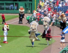 Washington Nationals racing president George Washington crosses the finish line ahead of Teddy Roosevelt, who pulled up the rear while riding a Segway
